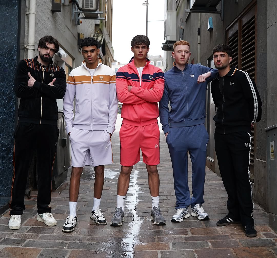 Five models in Sergio Tacchini tracksuits cut by Darlins Barbers
